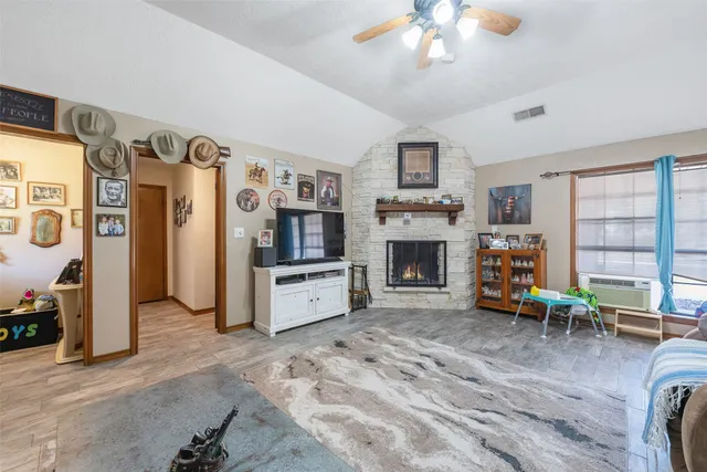 a view of a livingroom with furniture and a fireplace