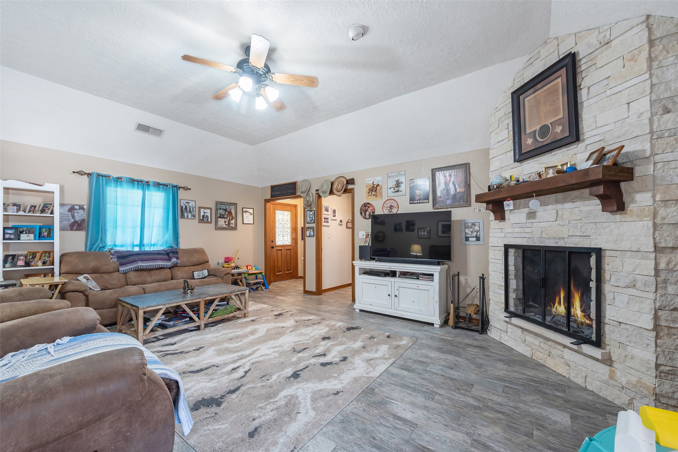 1014 Ginger Street Santa Fe, TX 77517 - Photo 8 of 50 a living room with furniture and a fireplace
