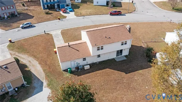an aerial view of residential houses with outdoor space
