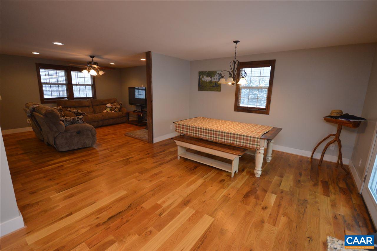 3633 Middle River Road Stanardsville, VA 22973 - Photo 12 of 26 a living room with furniture a ceiling fan and a wooden floor