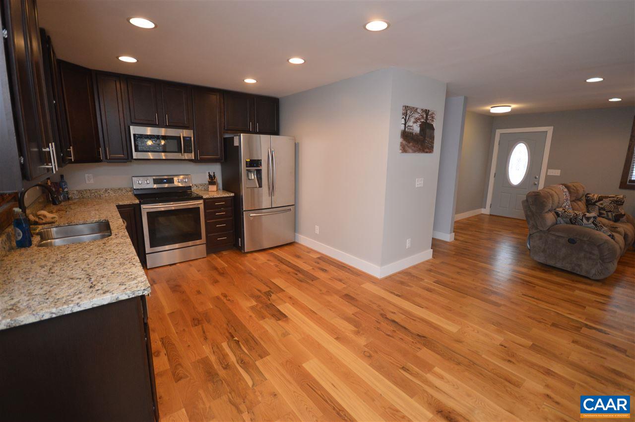 3633 Middle River Road Stanardsville, VA 22973 - Photo 13 of 26 a kitchen with stainless steel appliances granite countertop a refrigerator a stove top oven a sink and dishwasher