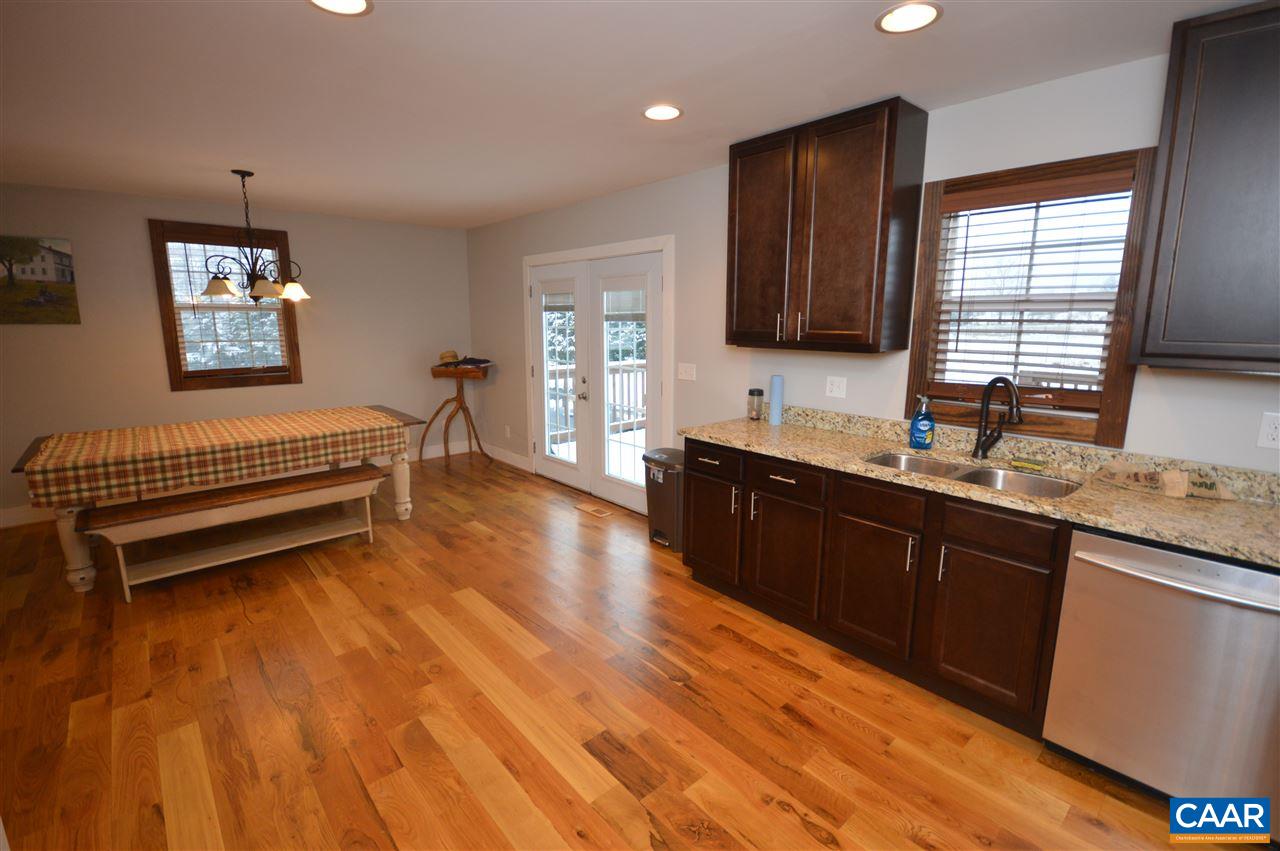 3633 Middle River Road Stanardsville, VA 22973 - Photo 14 of 26 a spacious bathroom with a granite countertop sink window and a mirror