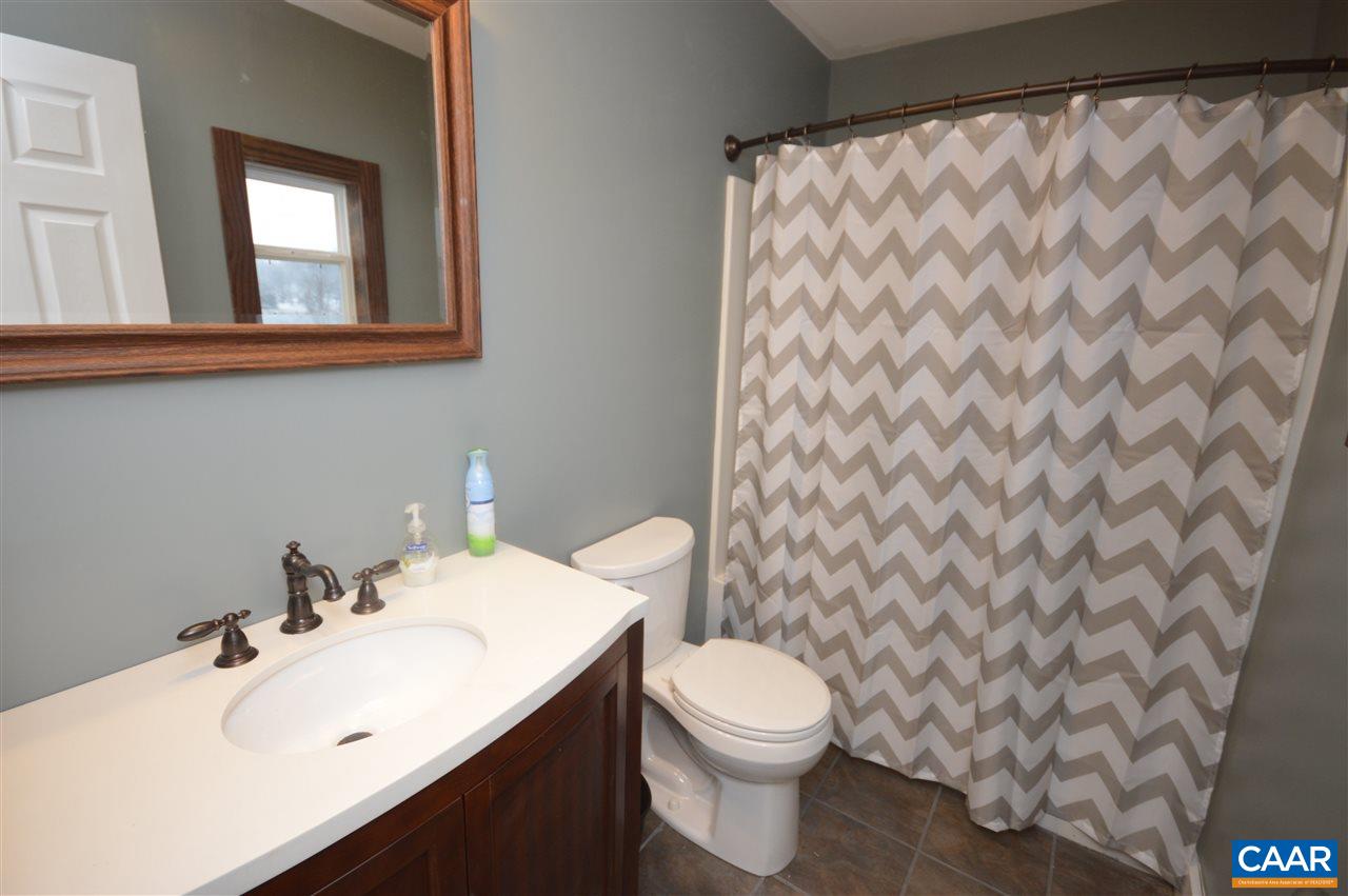 3633 Middle River Road Stanardsville, VA 22973 - Photo 18 of 26 a bathroom with a sink and a toilet