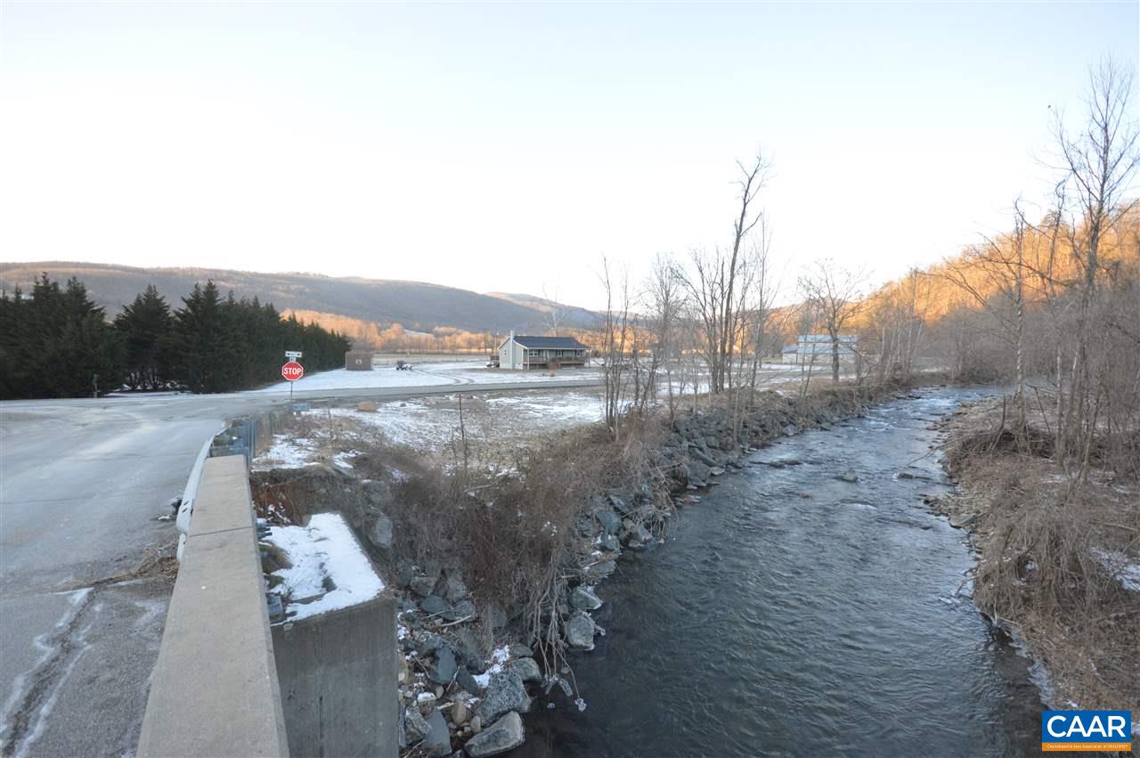 3633 Middle River Road Stanardsville, VA 22973 - Photo 24 of 26 a view of a lake with mountains in the background