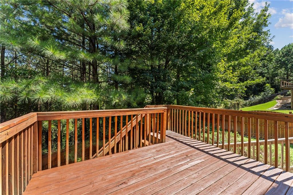 208 Sawtooth Court Canton, GA 30114 - Photo 15 of 31 a balcony with wooden floor and fence