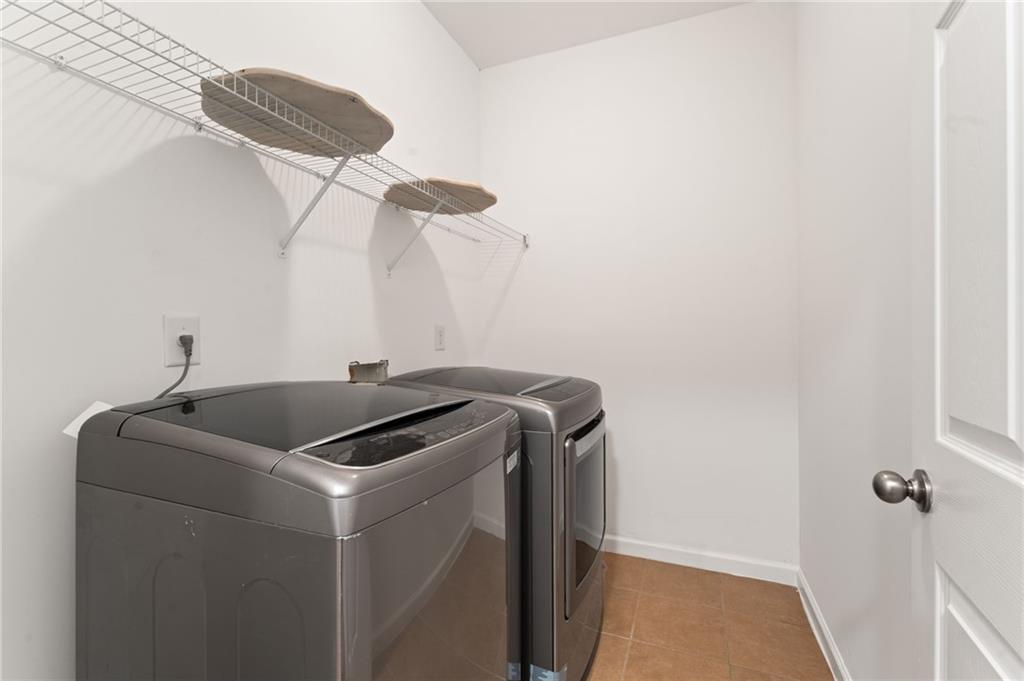 208 Sawtooth Court Canton, GA 30114 - Photo 16 of 31 a utility room with dryer and washer