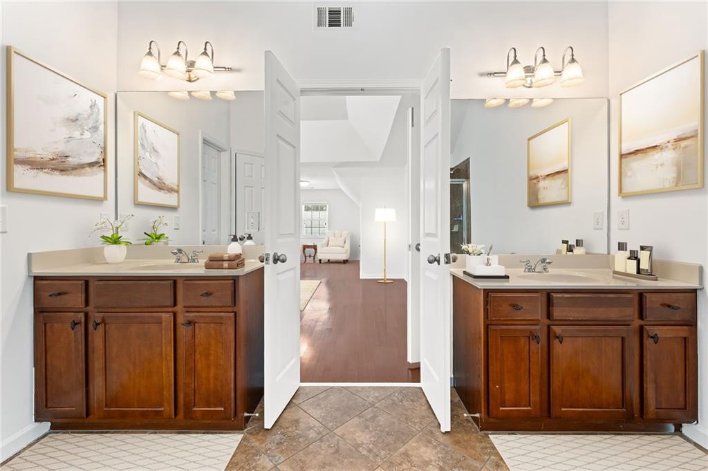 208 Sawtooth Court Canton, GA 30114 - Photo 20 of 31 a bathroom with a sink vanity and a mirror