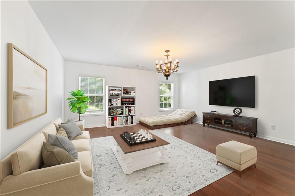 208 Sawtooth Court Canton, GA 30114 - Photo 27 of 31 a living room with furniture and a flat screen tv