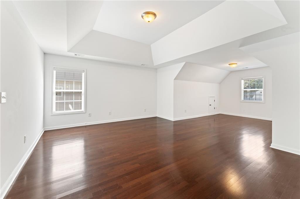 208 Sawtooth Court Canton, GA 30114 - Photo 28 of 31 a view of a room with wooden floor and window