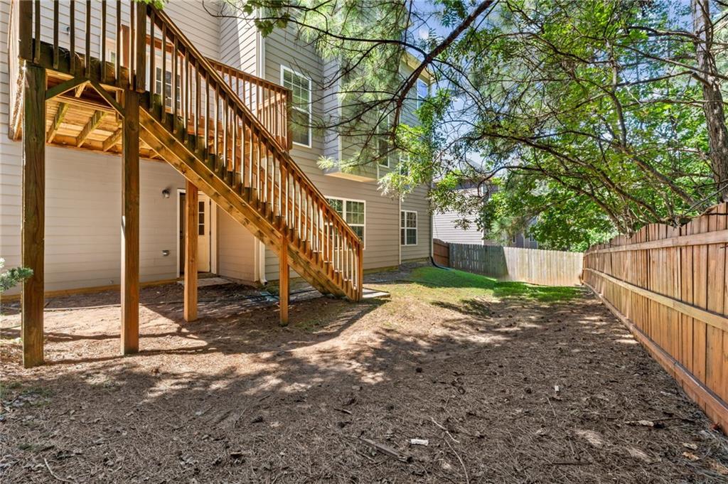208 Sawtooth Court Canton, GA 30114 - Photo 31 of 31 a view of a house with wooden fence