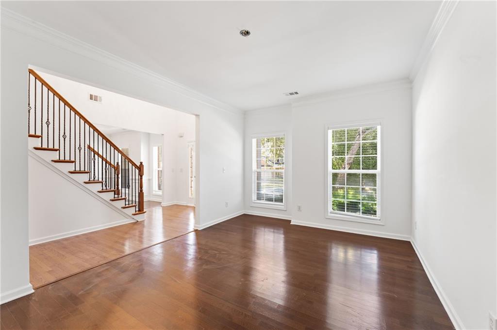 208 Sawtooth Court Canton, GA 30114 - Photo 8 of 31 wooden floor in an empty room with a window
