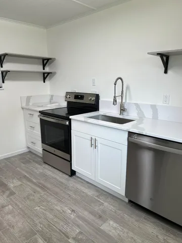 a kitchen with a sink and cabinets