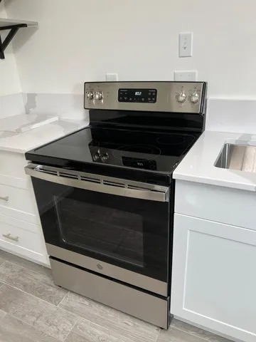 a kitchen with a sink and a refrigerator