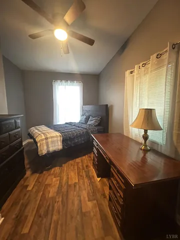 a bed room with a bed and a night stand