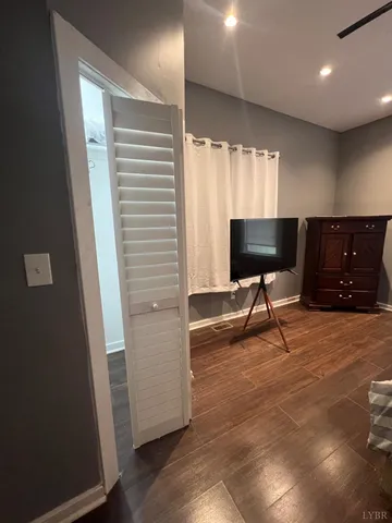 a view of a livingroom with furniture and a flat screen tv