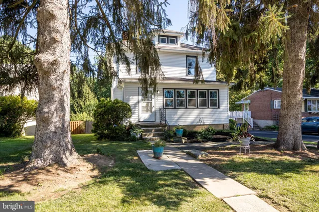 a swimming pool with outdoor seating and yard