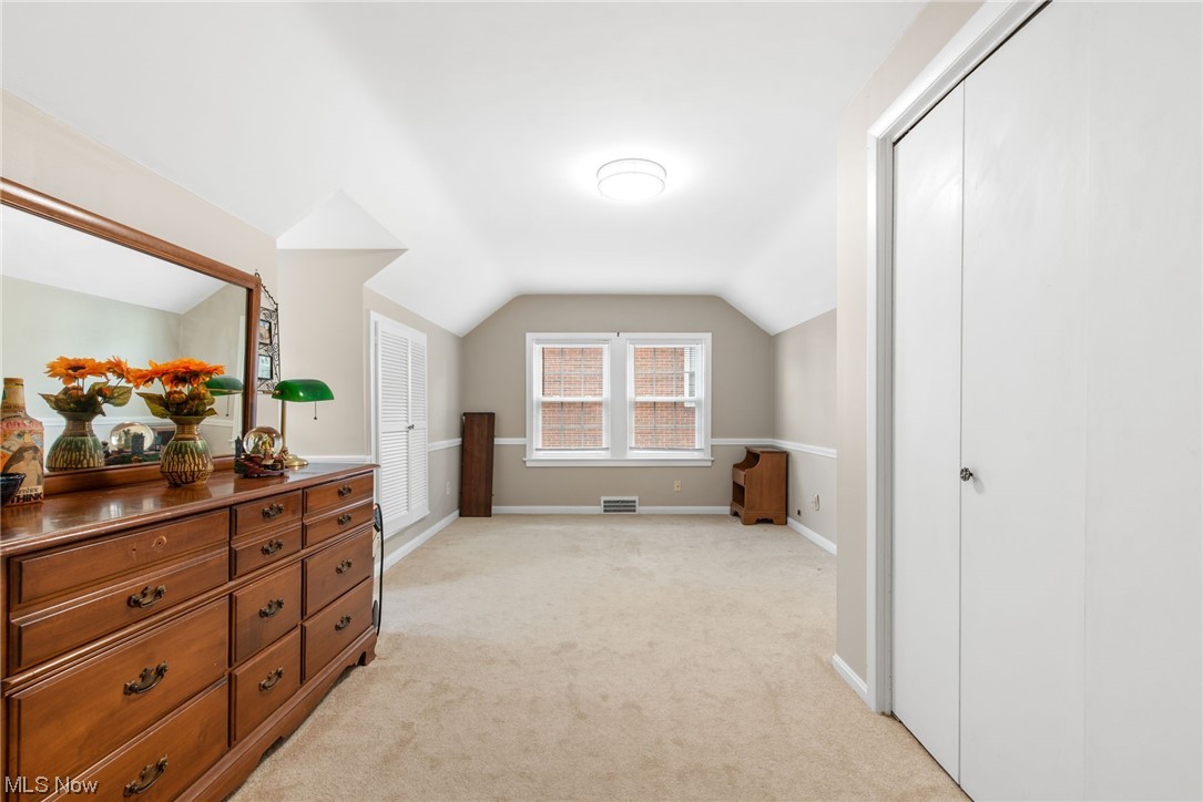 4206 Silsby Road Cleveland, OH 44118 - Photo 19 of 32 Bedroom featuring vaulted ceiling and light carpet