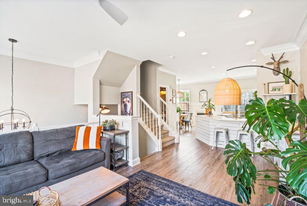 10136 Pale Rose Loop Bristow, VA 20136 - Photo 12 of 66 a living room with furniture and a wooden floor