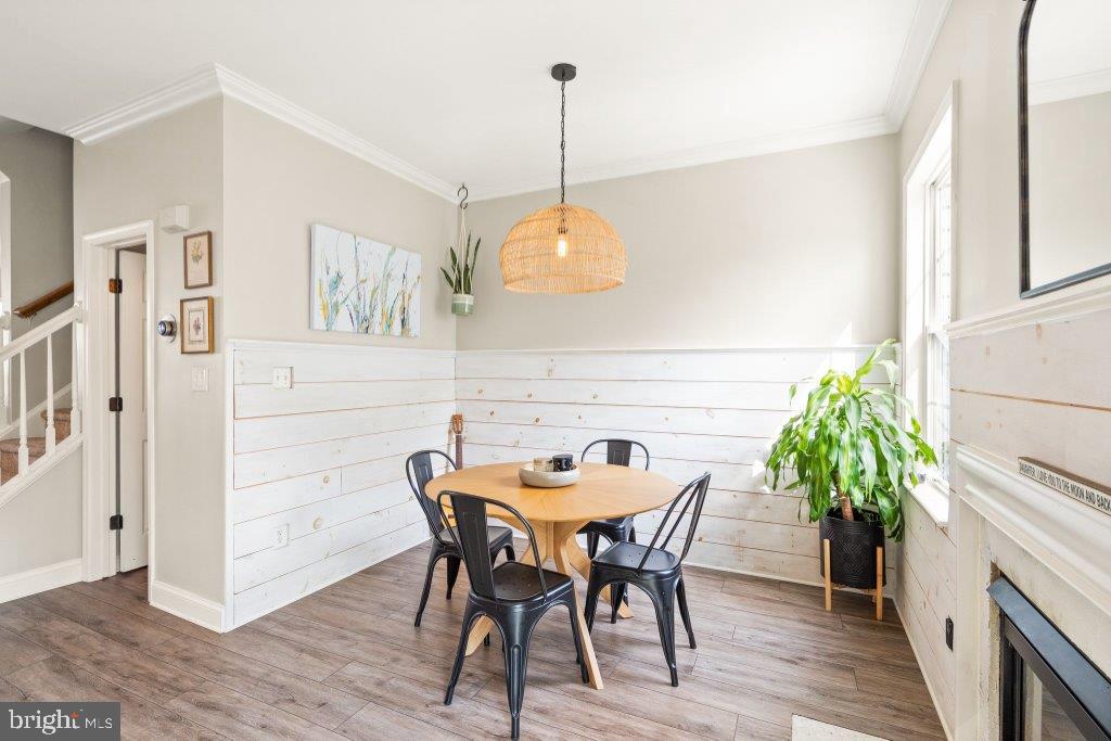 10136 Pale Rose Loop Bristow, VA 20136 - Photo 23 of 66 a view of a dining room with furniture and wooden floor