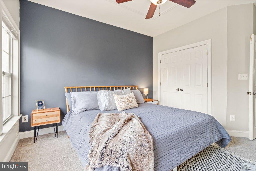 10136 Pale Rose Loop Bristow, VA 20136 - Photo 33 of 66 a bedroom with a bed and a couch