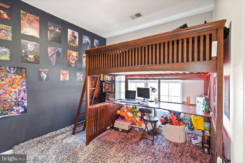 10136 Pale Rose Loop Bristow, VA 20136 - Photo 40 of 66 a view of a livingroom with furniture and toys