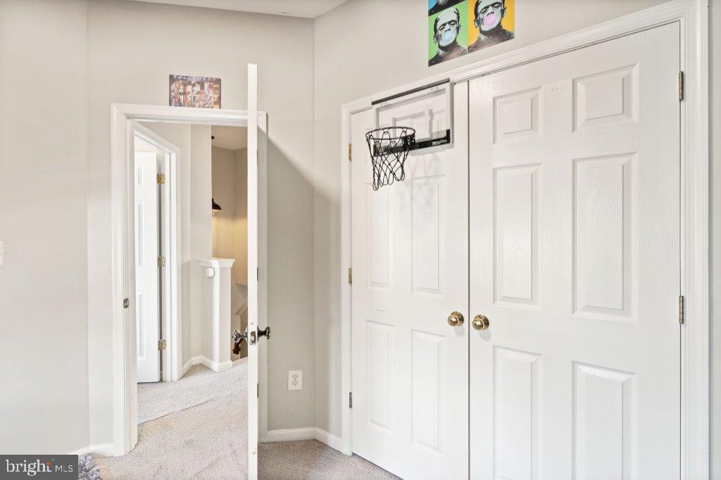 10136 Pale Rose Loop Bristow, VA 20136 - Photo 42 of 66 a view of a hallway with entryway door