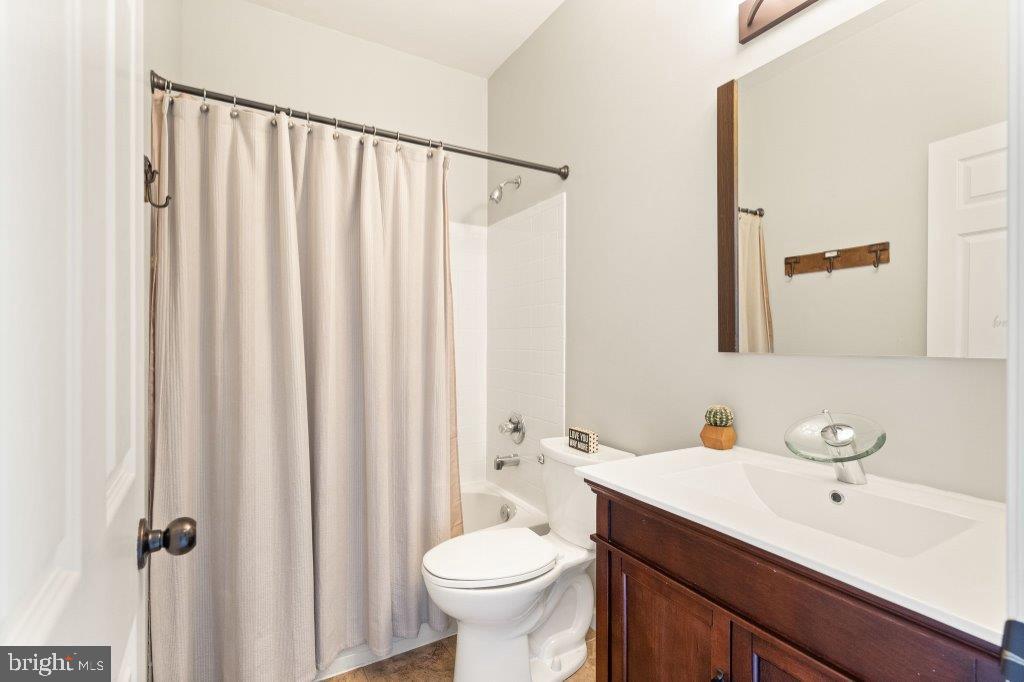10136 Pale Rose Loop Bristow, VA 20136 - Photo 46 of 66 a bathroom with a toilet sink and mirror