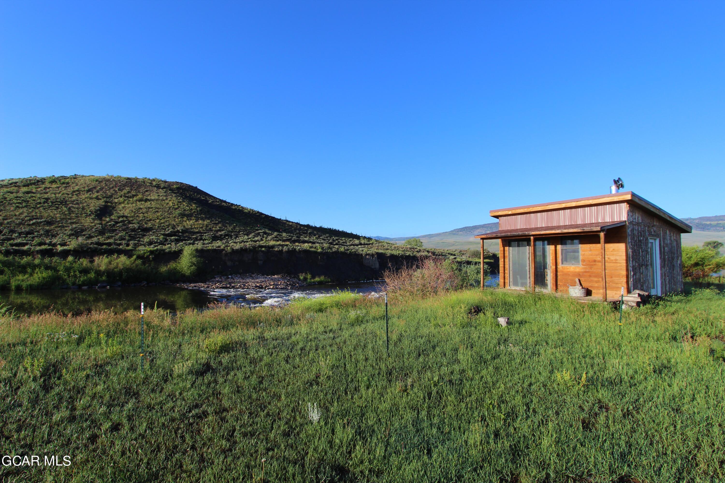 1921 Highway 9 Kremmling, CO 80459 - Photo 38 of 86 a view of a house with a yard