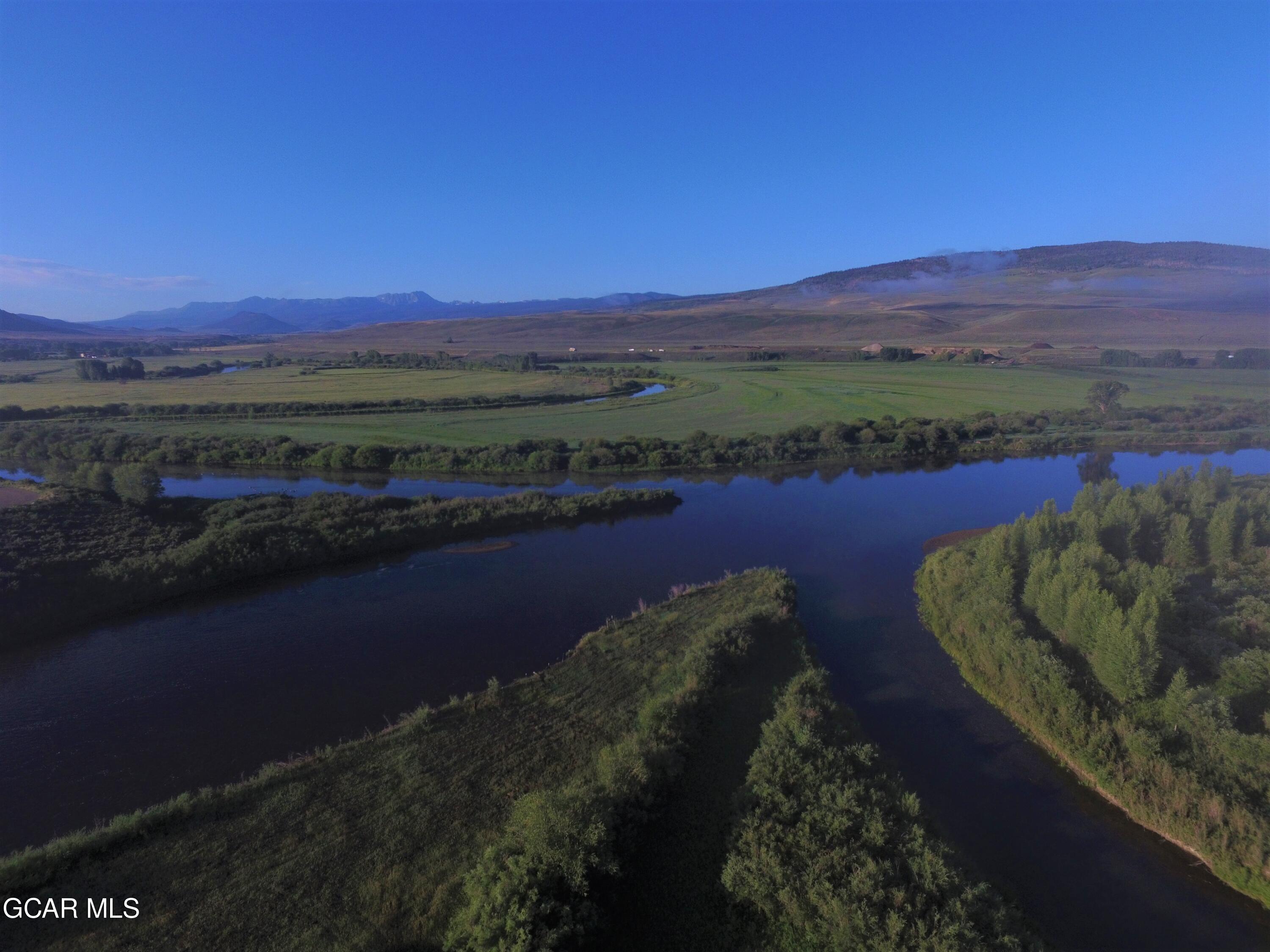 1921 Highway 9 Kremmling, CO 80459 - Photo 49 of 86 a view of a lake with a mountain in the background