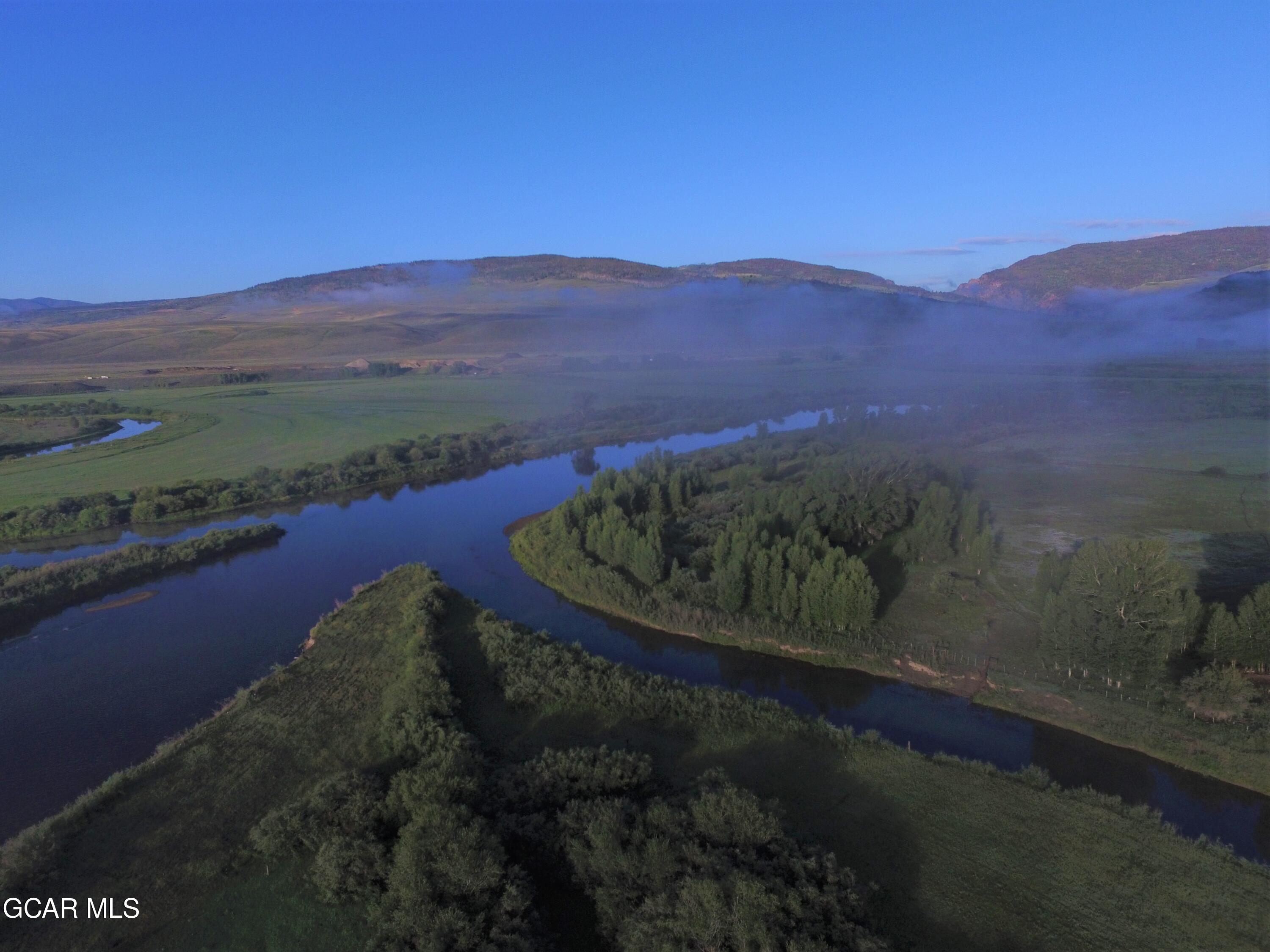 1921 Highway 9 Kremmling, CO 80459 - Photo 54 of 86 a view of a lake with a mountain in the background