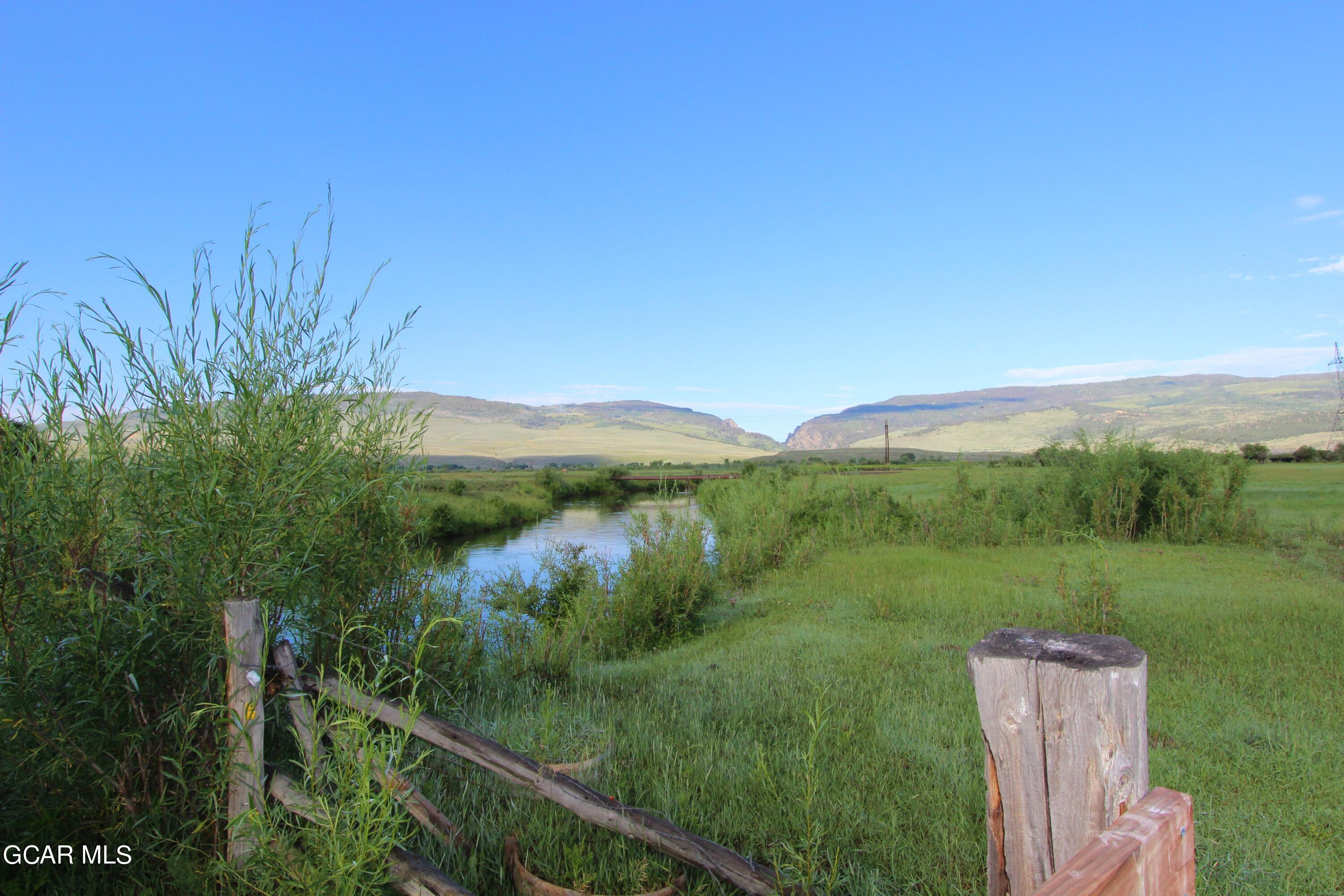 1921 Highway 9 Kremmling, CO 80459 - Photo 83 of 86 a view of a lush green outdoor space with a lake view