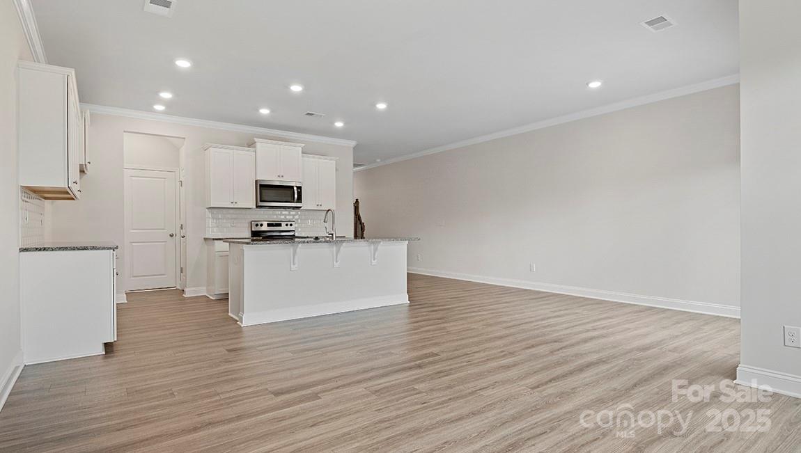 351 Lagoon Road Fletcher, NC 28732 - Photo 5 of 21 a view of kitchen with microwave and cabinets