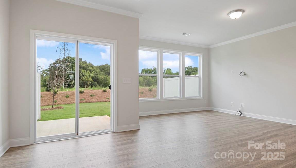 351 Lagoon Road Fletcher, NC 28732 - Photo 10 of 21 a view of an empty room with wooden floor and a window