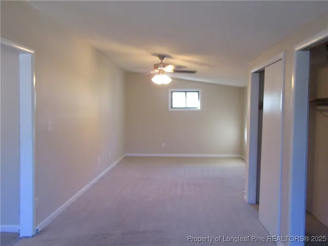 a view of empty room with windows