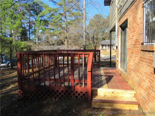 a view of a balcony with wooden floor