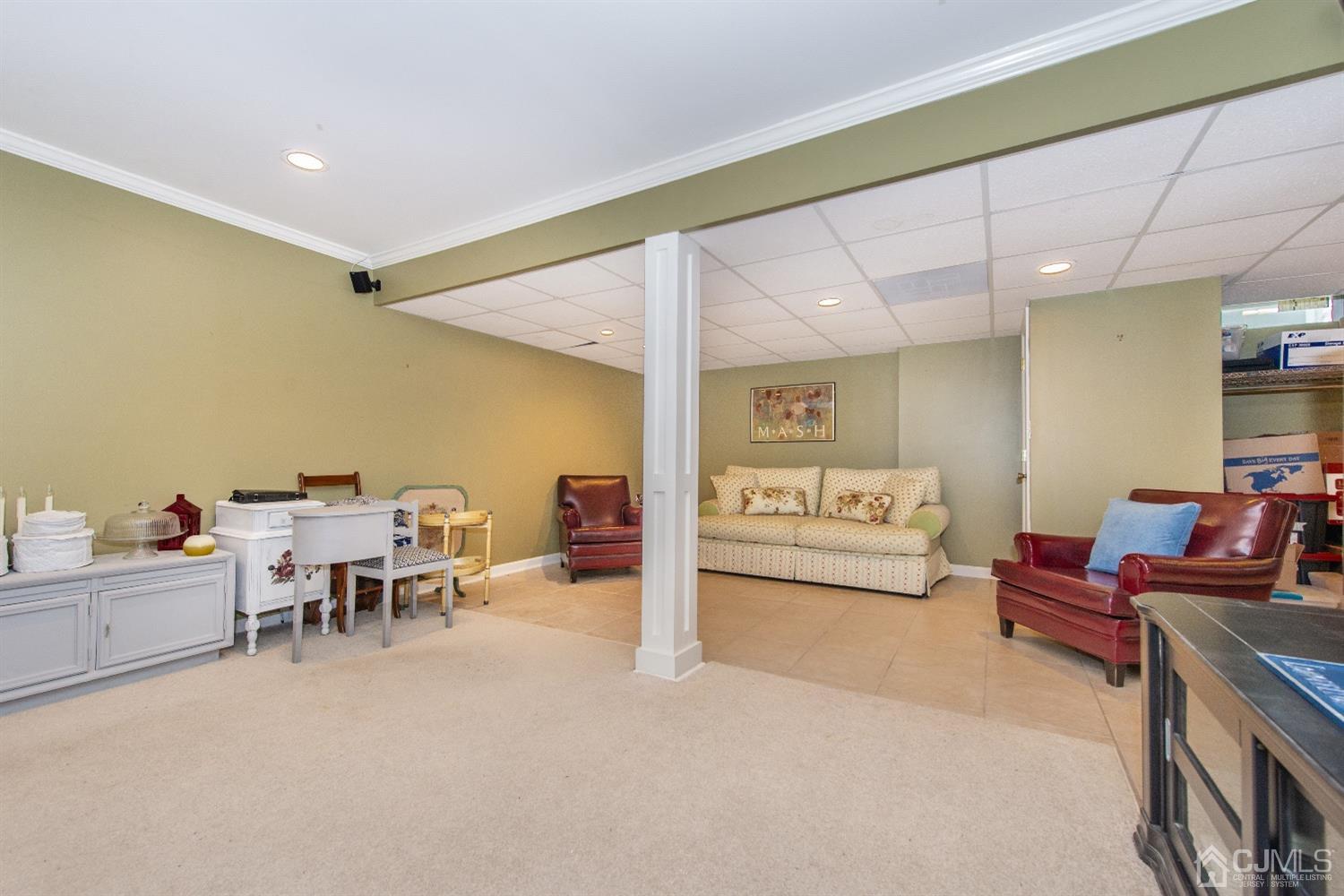 40 Longfellow Drive Colonia, NJ 07067 - Photo 13 of 24 a living room with furniture and a table
