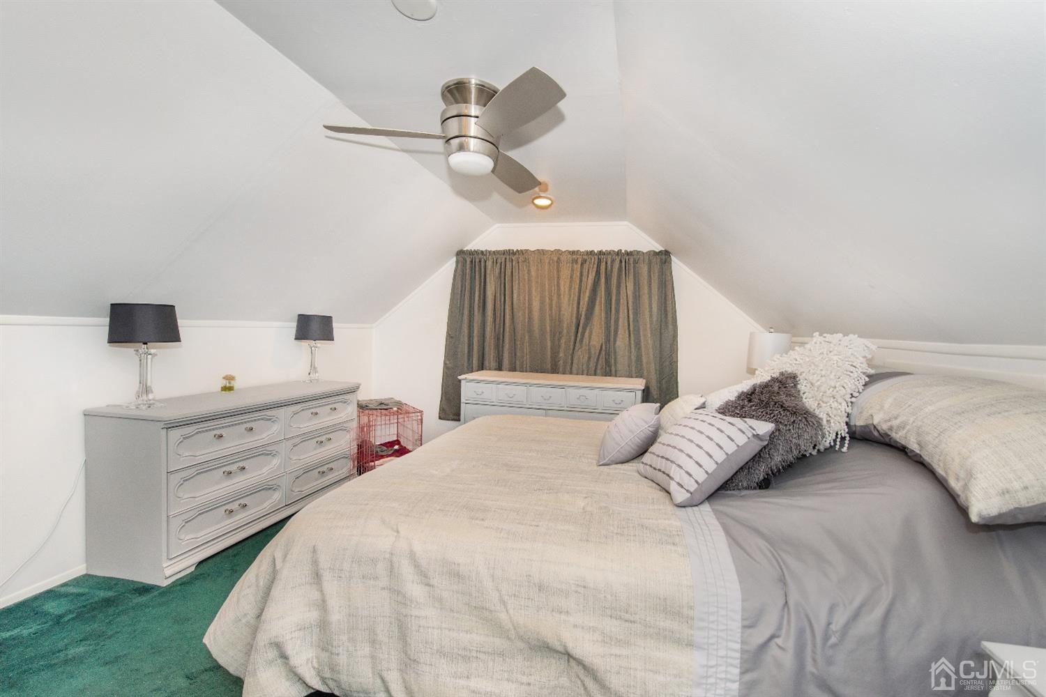 40 Longfellow Drive Colonia, NJ 07067 - Photo 18 of 24 a bedroom with a bed and a chandelier