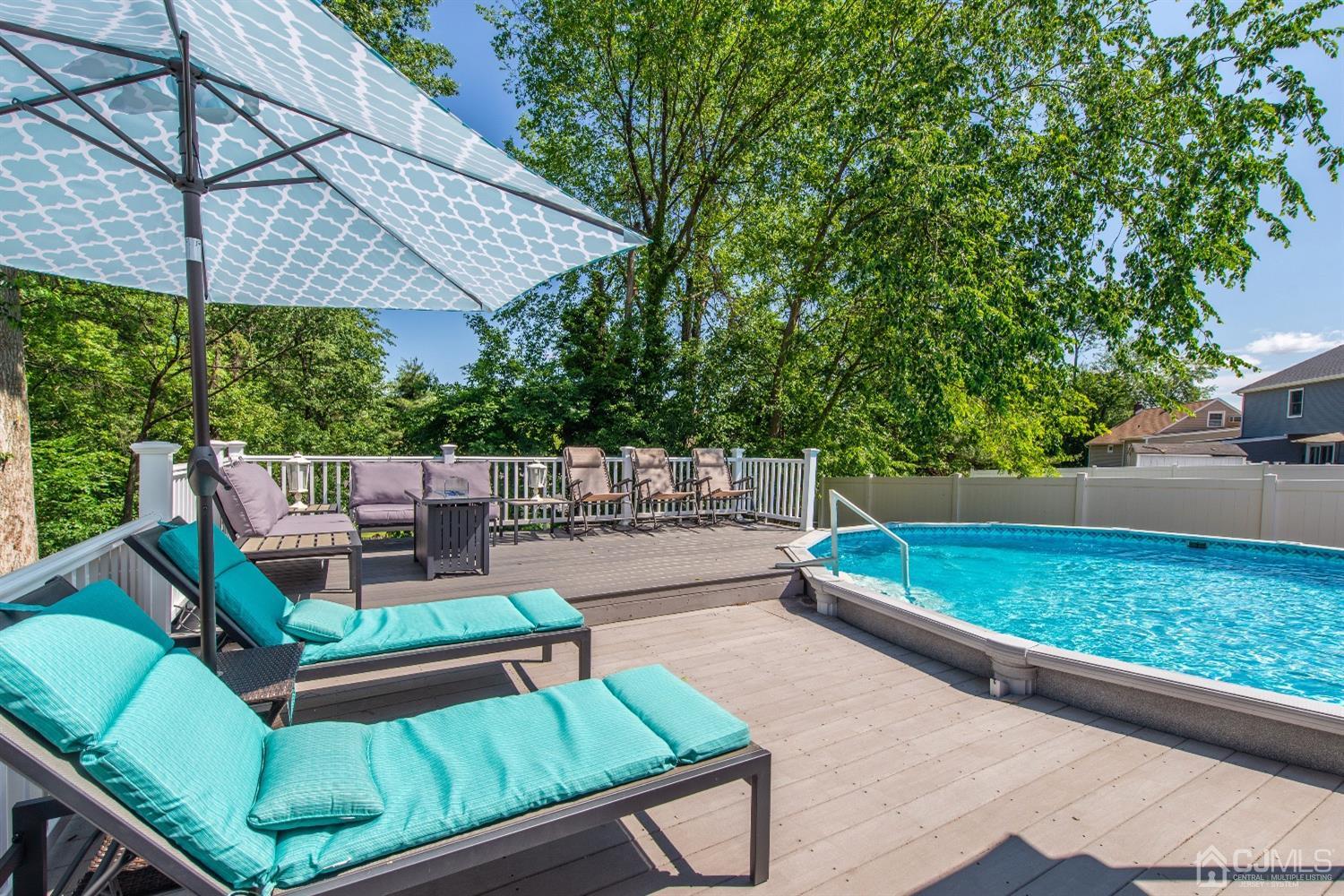40 Longfellow Drive Colonia, NJ 07067 - Photo 19 of 24 swimming pool view with a seating space