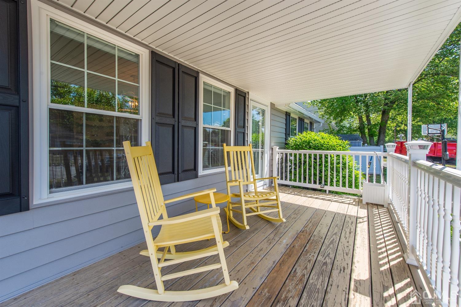 40 Longfellow Drive Colonia, NJ 07067 - Photo 2 of 24 a view of a chair and tables in the balcony