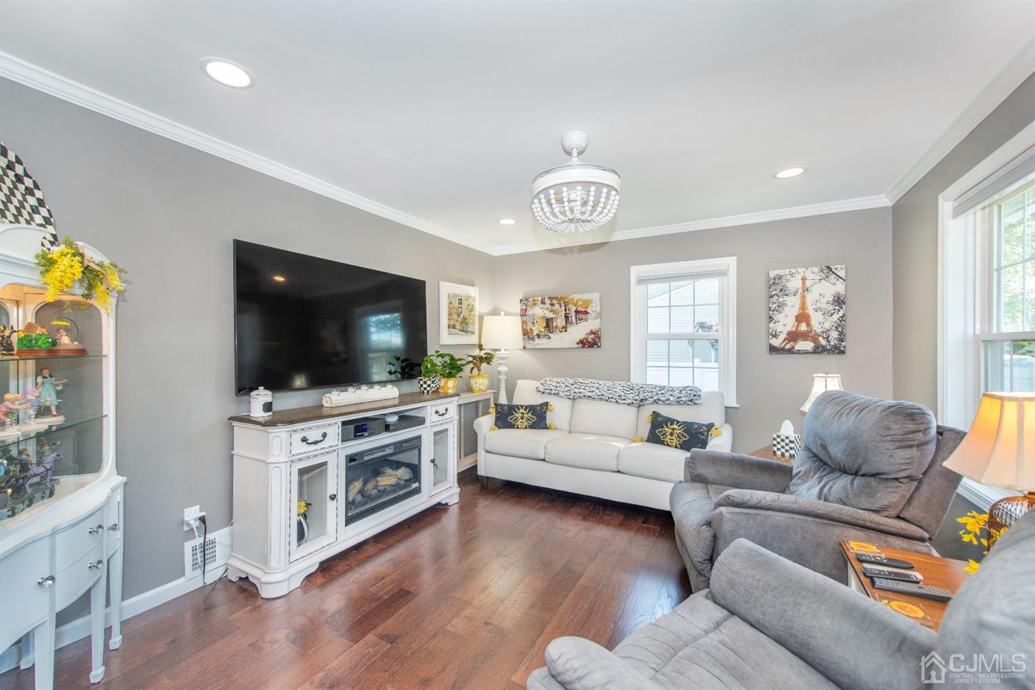 40 Longfellow Drive Colonia, NJ 07067 - Photo 4 of 24 a living room with furniture and a flat screen tv
