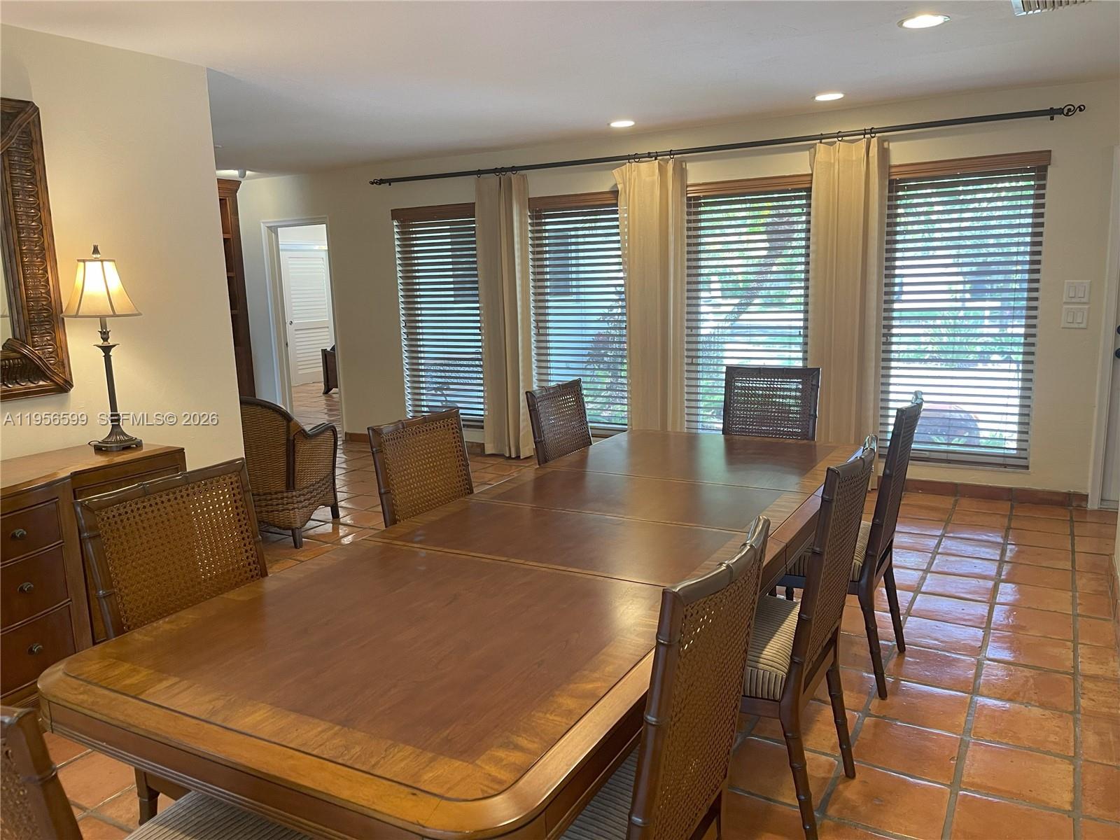 1110 Redbird Avenue Miami Springs, FL 33166 - Photo 11 of 25 a dining room with furniture and wooden floor