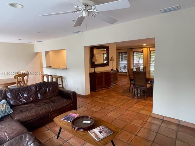 1110 Redbird Avenue Miami Springs, FL 33166 - Photo 15 of 25 a living room with furniture and a window