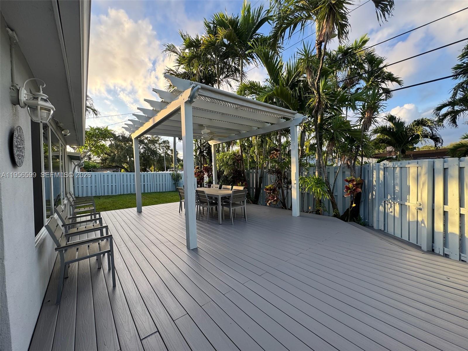 1110 Redbird Avenue Miami Springs, FL 33166 - Photo 24 of 25 swimming pool view with a seating space