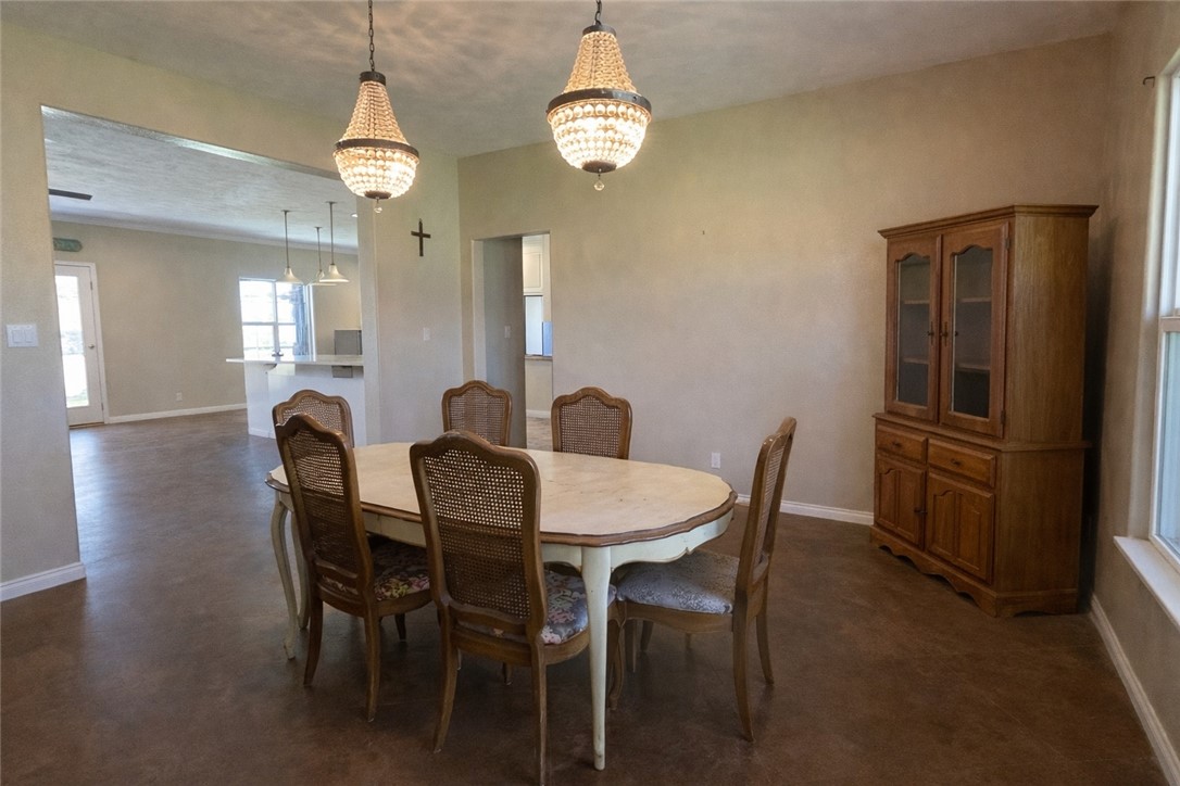 11810 Riley Green Road Franklin, TX 77856 - Photo 7 of 36 a view of a dining room with furniture and wooden floor