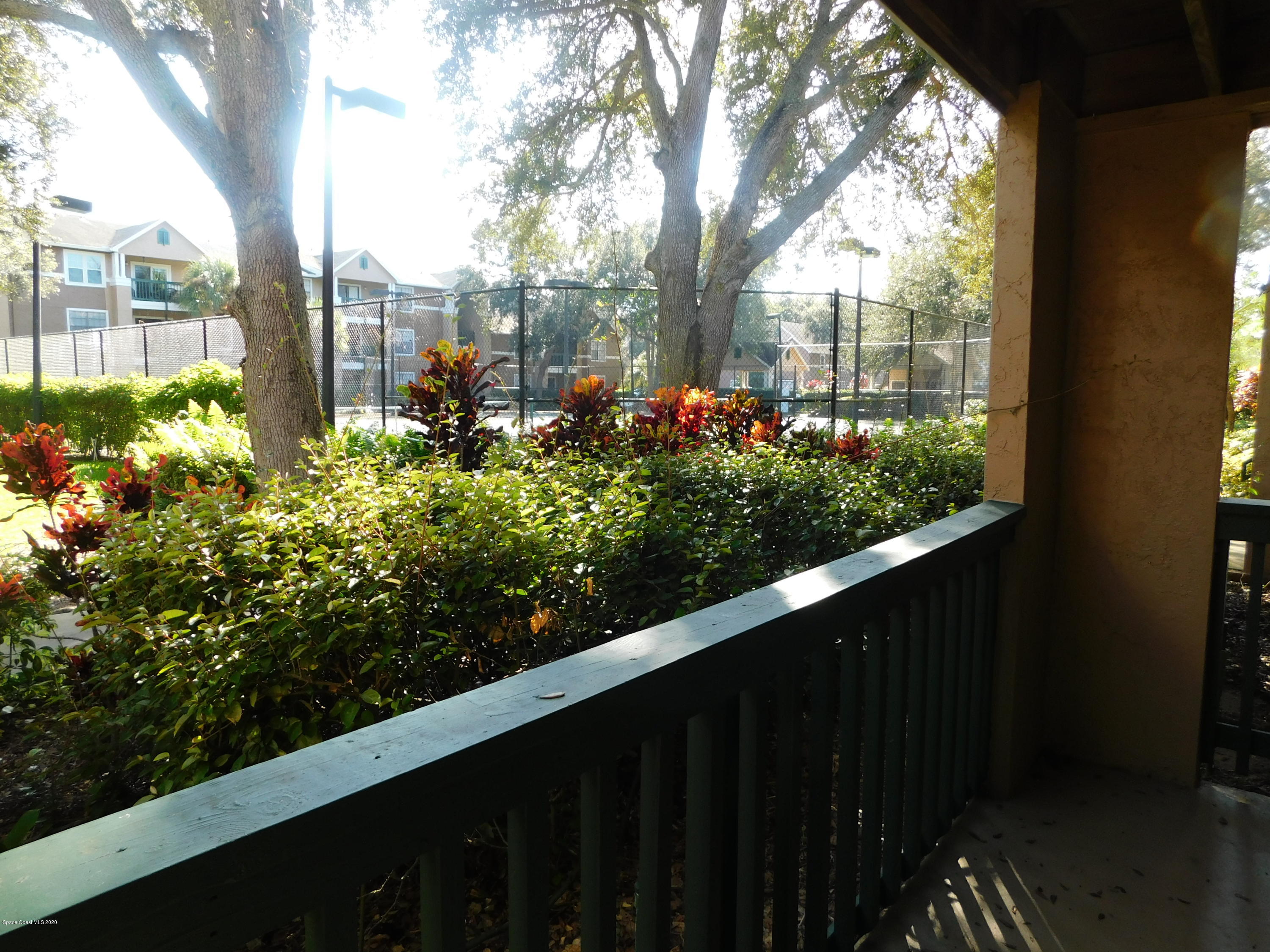 7667 North Wickham Road, Unit 902 Melbourne, FL 32940 - Photo 18 of 30 View of Tennis Court from Balcony