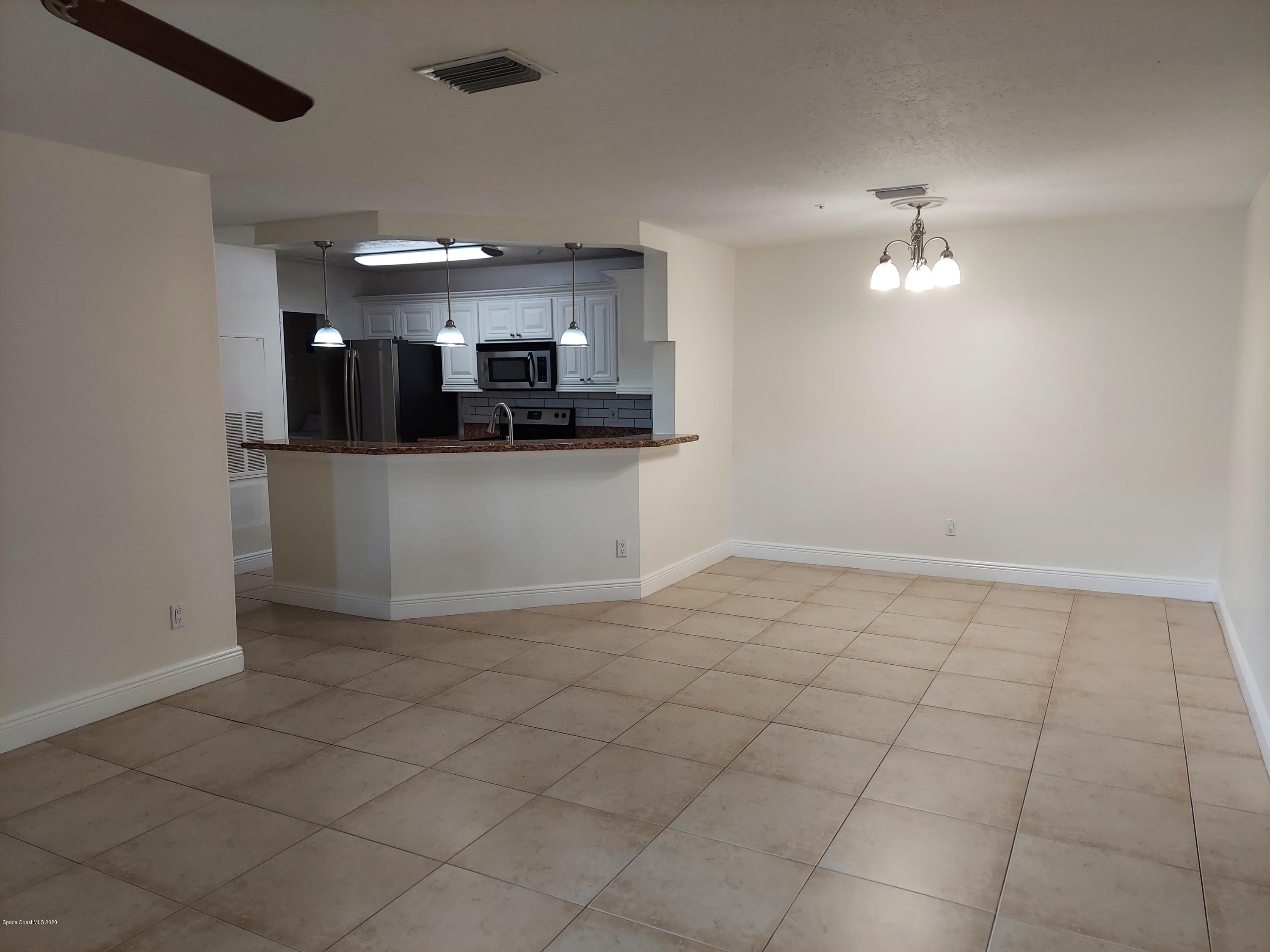 7667 North Wickham Road, Unit 902 Melbourne, FL 32940 - Photo 4 of 30 Living/Dining Room 1