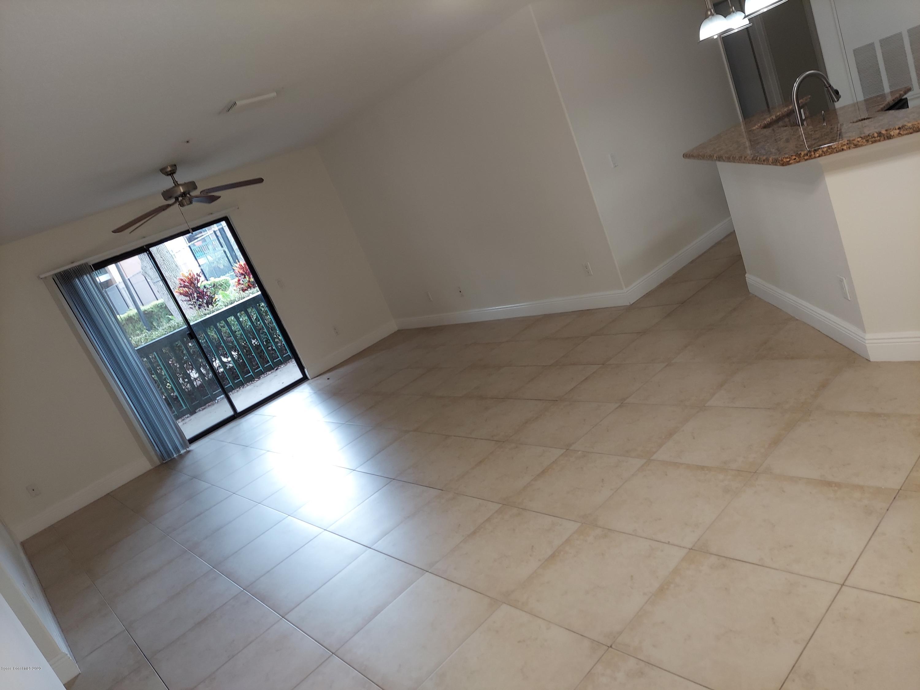 7667 North Wickham Road, Unit 902 Melbourne, FL 32940 - Photo 5 of 30 Living/Dining Room 3