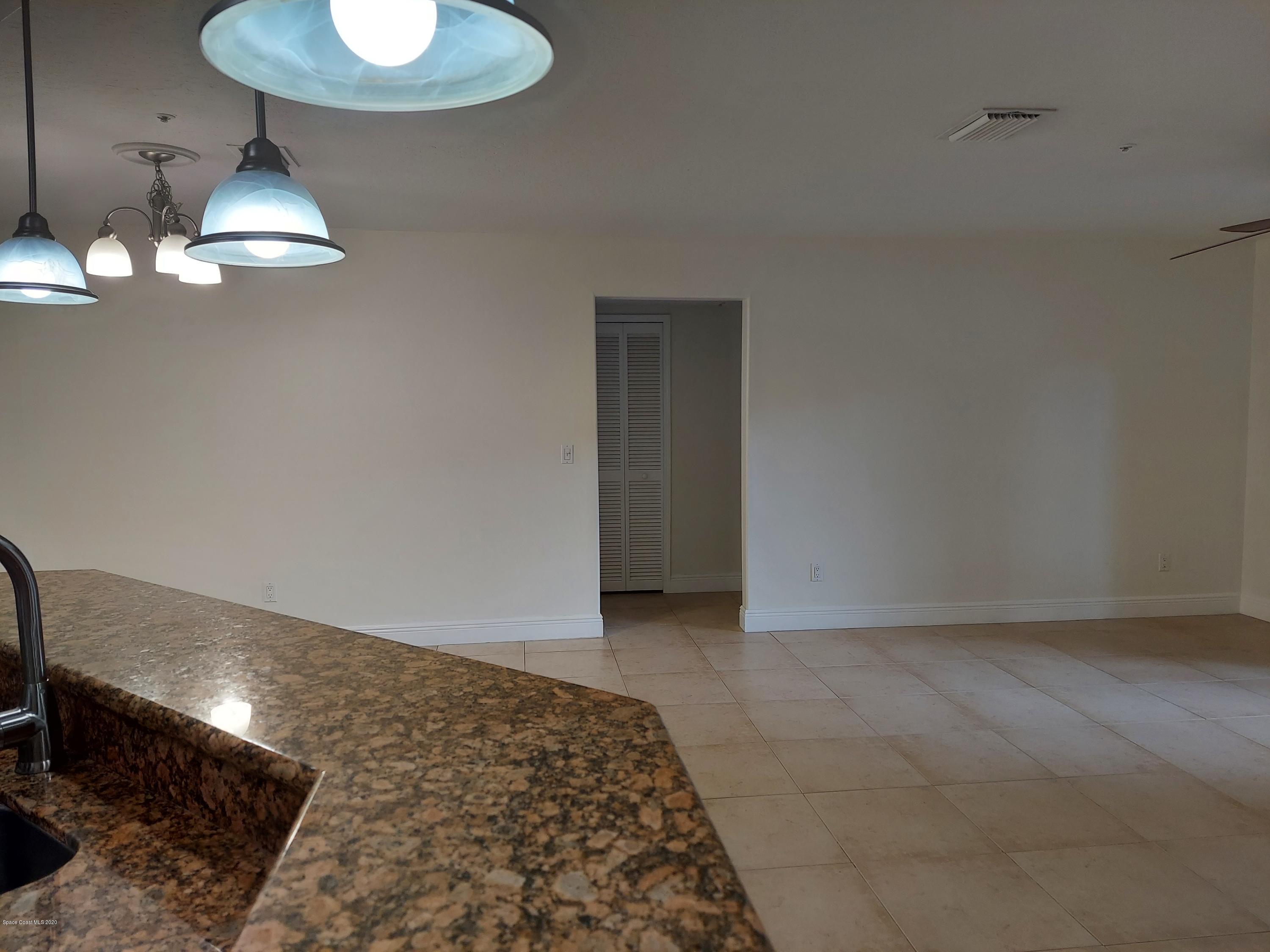 7667 North Wickham Road, Unit 902 Melbourne, FL 32940 - Photo 7 of 30 Living/Dining Room 2