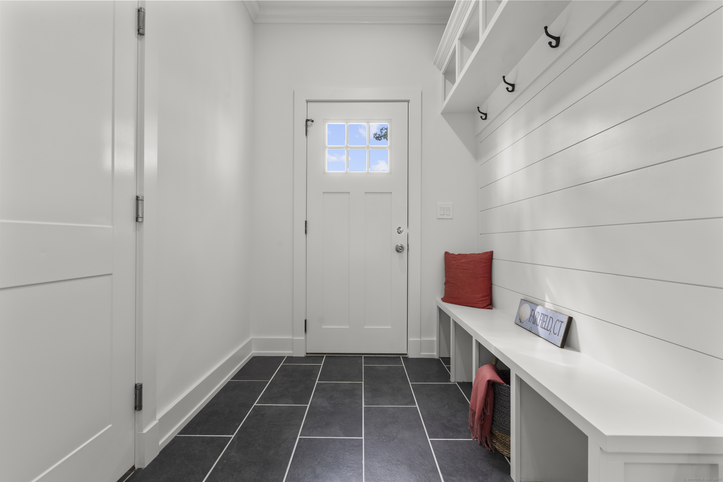 706 Judd Street Fairfield, CT 06824 - Photo 14 of 40 a hallway with cabinets