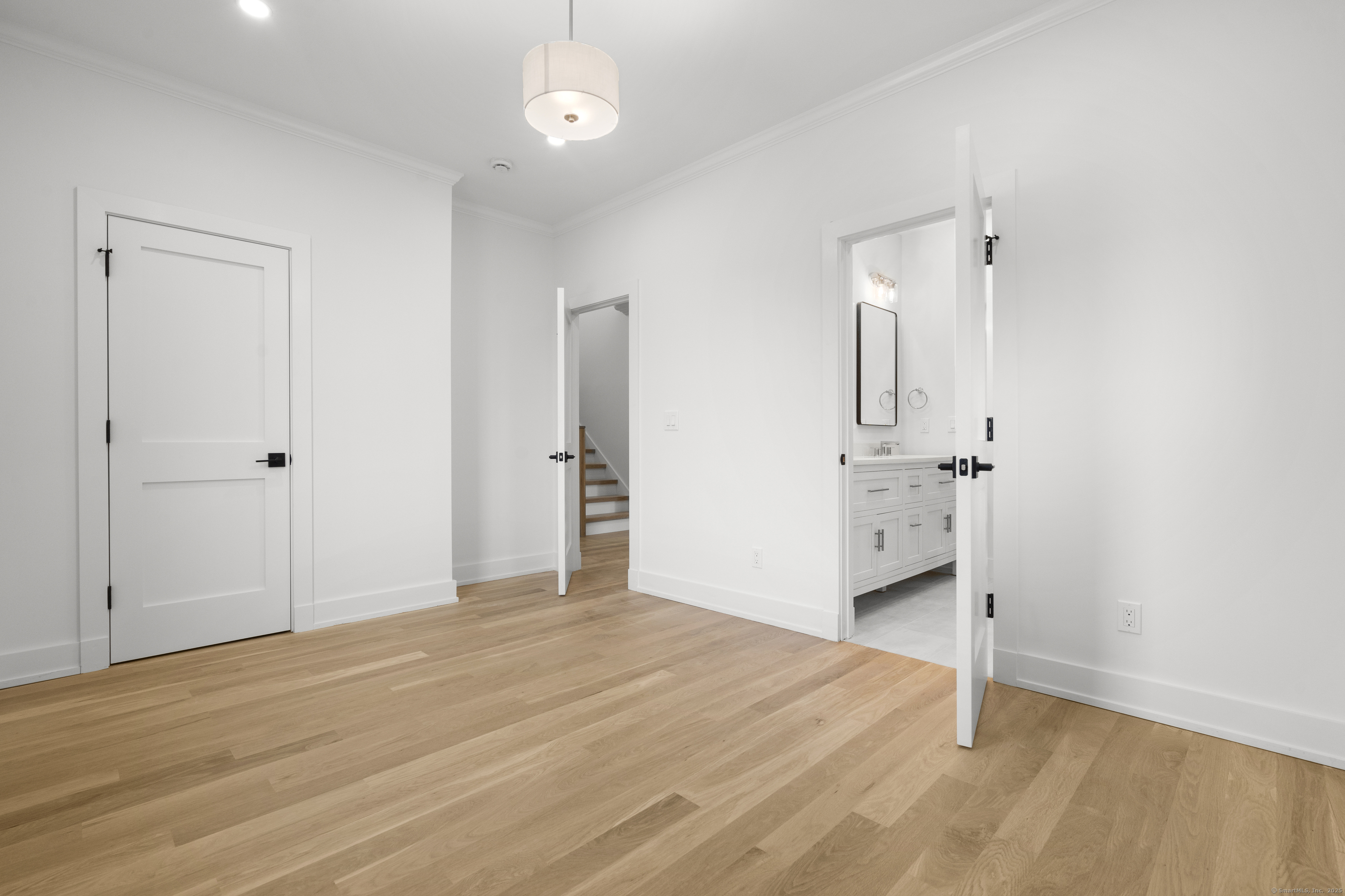 706 Judd Street Fairfield, CT 06824 - Photo 21 of 40 a view of empty room with wooden floor